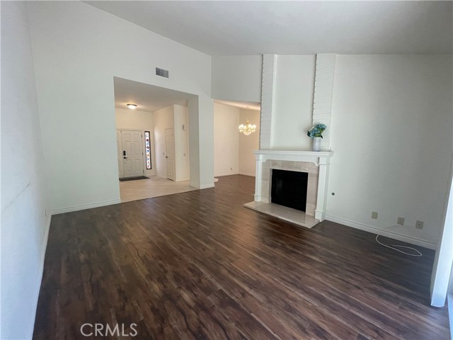 Living room looking towards dining room, kitchen entrance and foyer