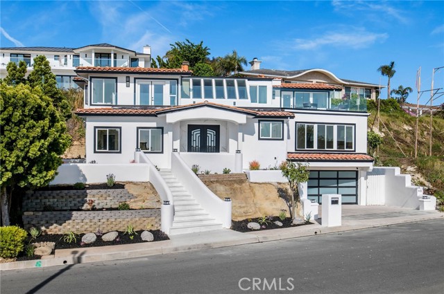 A three-car garage, extra driveway parking add to its undeniable desirability.