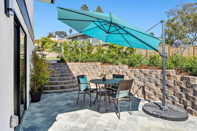 Adorable private patio off the lower level 5th bedroom.  Your guests will want to stay forever!