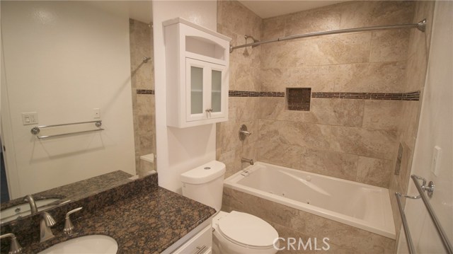 Master bath #1 w/floor to ceiling travertine tile