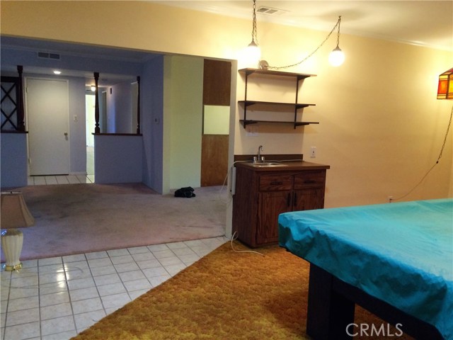 From game room looking in to living room and entry way.