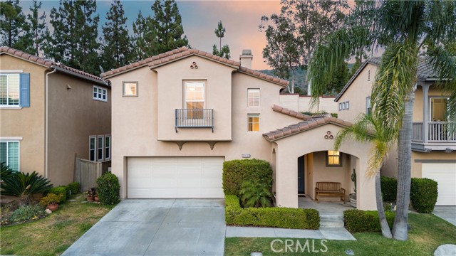 Welcome to 10048 Albee Ave, a fully remodeled 3-bedroom, 2.5-bathroom home nestled in the prime gated community of Vidorra in upper Tustin Ranch. This turn-key 1,510 square foot home offers an open-concept floor plan with vaulted ceilings and a cozy fireplace in the Family Room, and luxurious finishes throughout including LVP flooring on the main floor and bathrooms adorned with marble veined tile and the bedrooms with plush carpet. The light and bright Kitchen boasts direct garage access, a spacious dining area, bar seating, quartz countertops, stainless steel appliances, and a mosaic backsplash. Enjoy the ultimate privacy of a backyard with no rear neighbors, only a hillside greenbelt view behind, designed for low maintenance entertaining with newer pavers and landscaping. Additional features of the main level include a 2-car garage with a dedicated driveway and a convenient Powder Room for guests. Upstairs, the Primary Suite is a true retreat with dual closets, a large ensuite bath with dual vanities, a glass walk-in shower, tile flooring, and quartz countertops. All the bedrooms are on the same level, ideal for family living, with a stunning jack-and-jill bathroom between the two secondary suites. Vidorra offers its residents exclusive amenities including a private gate to Peters Canyon Regional Park, an expansive central greenbelt for walks within the gated community, and proximity to Pioneer Road Park. With low HOA dues of $210 a month, no Mello-Roos, and new HVAC, this turn-key home is the epitome of luxury and convenience - all with access to award winning schools! 10048 Albee Ave is also close to shopping and dining at the Market Place, Cedar Grove Park, and Tustin Ranch Golf Club. Don't miss the opportunity to make this move-in-ready home yours and schedule a tour today!