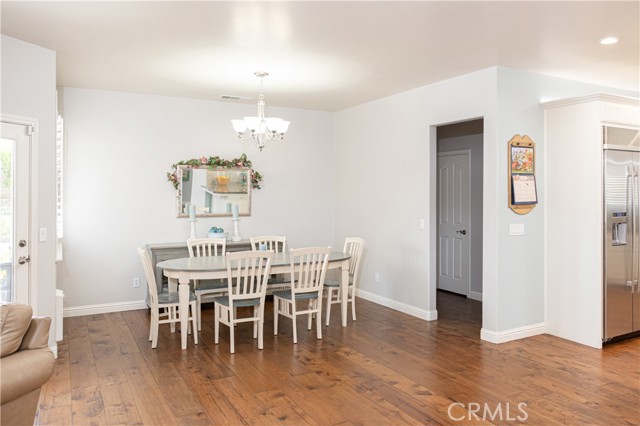 Dining room next to the kitchen with the entry into the master bedroom through the hallway.