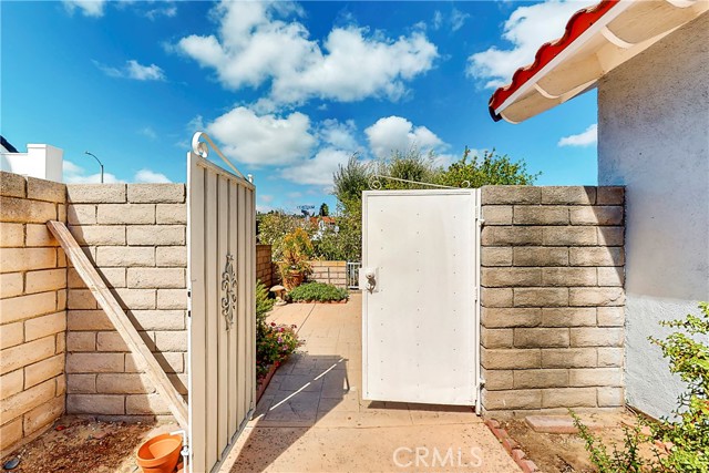 Security doors between side yard and large front patio.