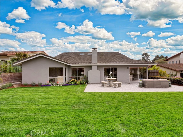 View from back yard towards house and patio.