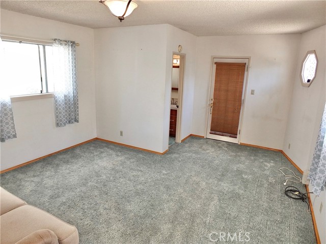 Family room has adjacent guest bathroom & access to backyard