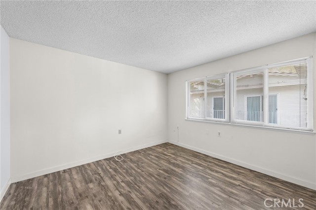 Another view of Bedroom showing other side with windows.