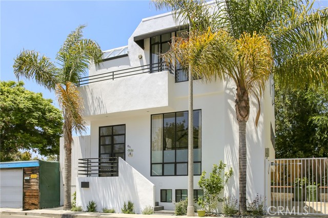Proud to introduce the incredible post-modern architectural home in the highly desired Silver Triangle neighborhood of Venice with 100% walk score, fully remodeled in 2018! Upon entering, immediately be amazed with the interior design that produces design classics like the tall ceiling space that pairs amazingly with the open floor concept. The airy split-level living room with fireplace and floor-to-ceiling windows blends seamlessly with the dining room/ kitchen area, wet bar, powder room and laundry area of the main floor. The contemporary kitchen boasts stainless steel appliances, Caesarstone countertops, recessed lights, window placements that demand ample natural light and a large chef island great for preparing meals and space for ample seating. On the top floor experience the three bedrooms that feature hardwood floors and ample natural light throughout. The primary suite treats you with a personal balcony to take in the ocean breeze, gas fireplace, floor to ceiling window and ensuite bathroom that consists of skylights, oversized bathtub and stand alone glass-enclosed modern shower space.  The bottom floor of this tri-level home provides a tremendous opportunity of splitting into a separate ADU unit that features one bedroom, one bathroom, new kitchenette build and an incredible opportunity for Air BNB with short/long term rental capabilities (producing average of $6500 a month). Combined rental income has generated over $200,000 per year! Additional features include brand new American Standard central air and heat, covered patio in the back complete with cozy firepit lounge and BBQ dining area, and previously approved and permitted architectural plans to build a rooftop deck with interior stairway access that will create breathtaking views of Venice. You are moments from the Venice Canals, Abbot Kinney Boulevard, Venice Blvd, Venice Boardwalk and experience some of the staples of the community like the Venice Farmers Market, Erewhon grocery market, Venice Library and so much more!!!