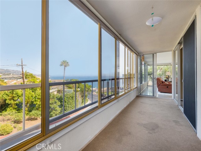 Ocean views from the balcony that's accessible from both bedrooms and living room. Living room is visible.