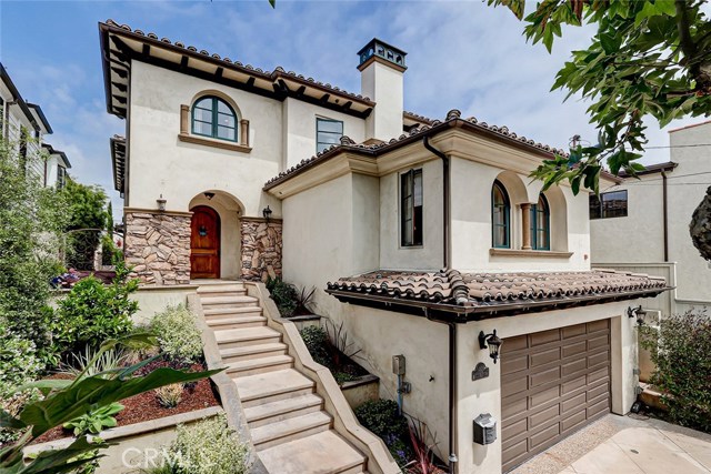 1406 Laurel Avenue Manhattan Beach, California One of the great joys of living in MB, is finding a big home, on a big lot, with very a short convenient walkability, this luxury home does just that. Located Just steps from two award-winning schools (AMS & Pacific) and a straight shot West 3 blocks to Downtown. This location is ideal for those seeking more outdoor space paired w/ ease of access to all the community happenings & the beach. It features a soft, coastal interior design crafted by Kate Lester interiors. The formal living room has a large fireplace, built-in library shelving & wet bar. The formal dining room enjoys views of the interior courtyard. The large family room has a stone fireplace & built-in media cabinets. The custom kitchen features glass-faced cabinets, tray ceilings, center island w/ built-in microwave, pot filler, Viking range, walk-in pantry. From the kitchen, step into a sun-filled breakfast room. French doors open to an entertainer's backyard w/ drought-tolerant landscaping & retractable sun shades. The upper level finds the expansive master bedroom retreat w/ private fireplace, large walk-in closet, elegant master bath & an office/nursery area. Two more bedroom suites & the laundry room are also located on this level. The entry level has a mother-in-law suite & the lower level has a private guest suite! The 3-car garage features built-in shelving & storage. The Badminton Club, Metlox Plaza, the weekly Farmer's market, sports fields, Live Oak Park & more are all within walking distance!