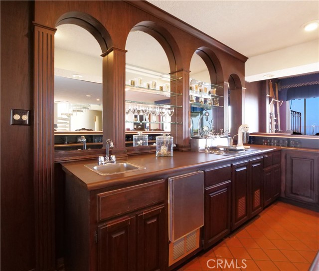 Wet bar with sink and refrigerator