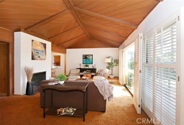 Living room with high wood ceilings