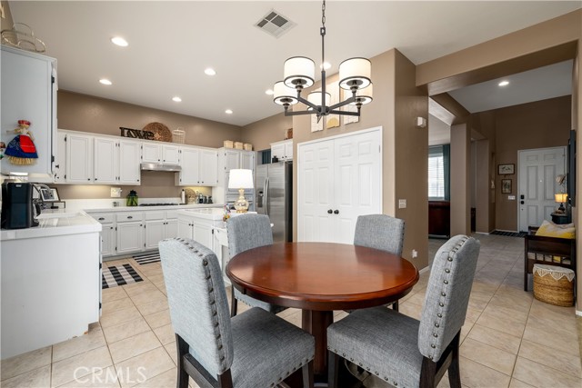 View of eating area and kitchen.