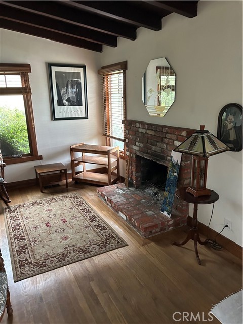 Living room with brick face fireplace