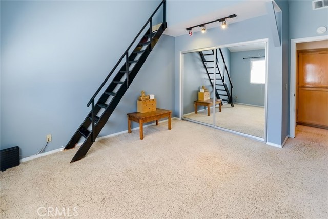 Third bedroom with a loft bed for extra space in addition to the full closet.