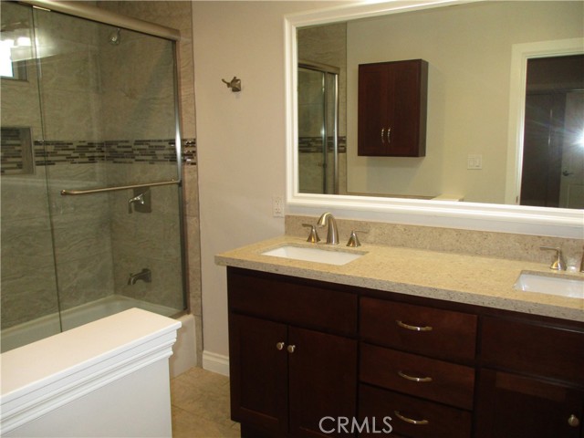 Updated primary bathroom with 2 sinks.