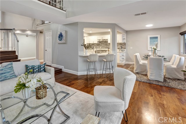 beautiful floors dining and open kitchen.