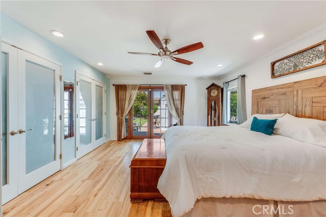 Primary bedroom with french doors to backyard