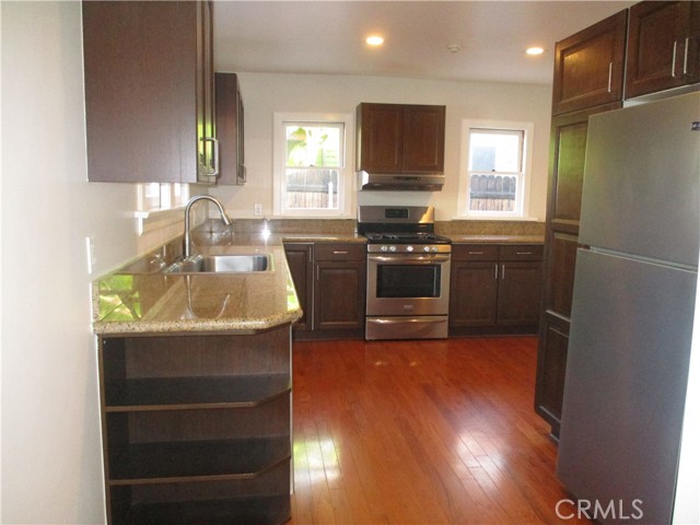 Updated kitchen with loads of cabinet and counter space. Bright and airy with multiple windows looking towards the backyard.