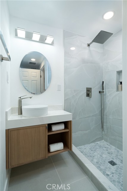 Powder room with shower in the hallway. Powder room with shower in the hallway.