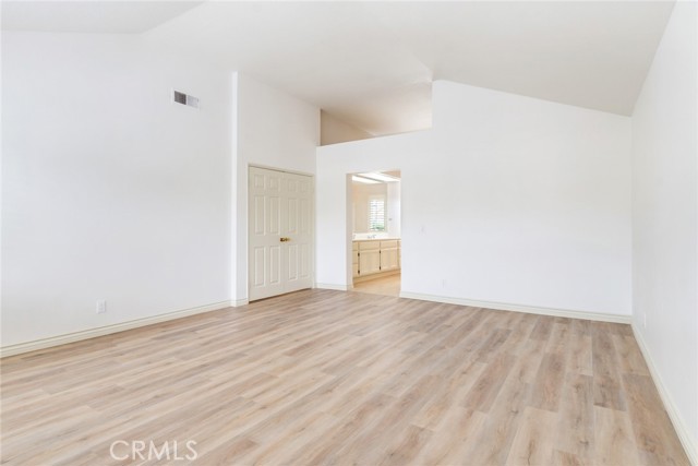 Reverse View of Primary Bedroom Looking toward En-Suite Bathroom