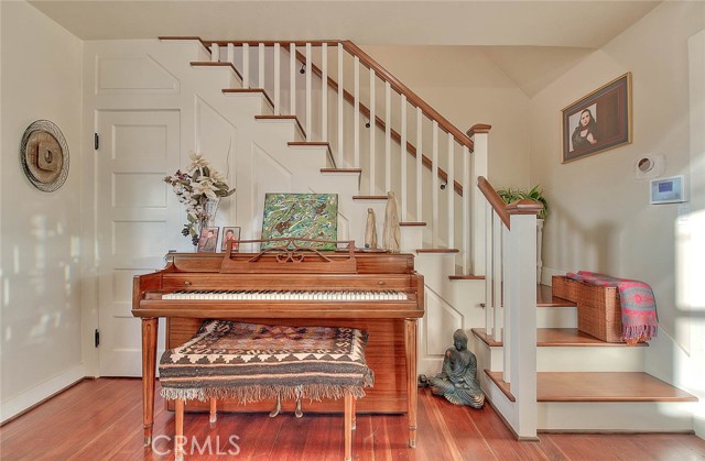 Foyer/Steps to Upstairs with convenient closet below stairs