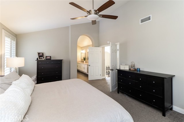 primary bedroom with ceiling fan