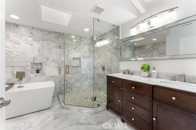 Primary bathroom in marble tile