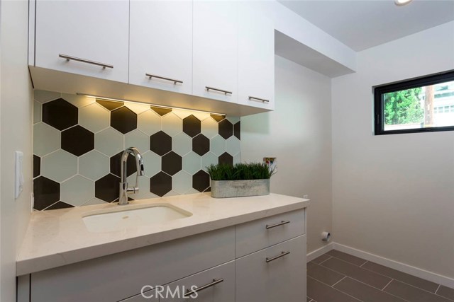 Laundry room with sink