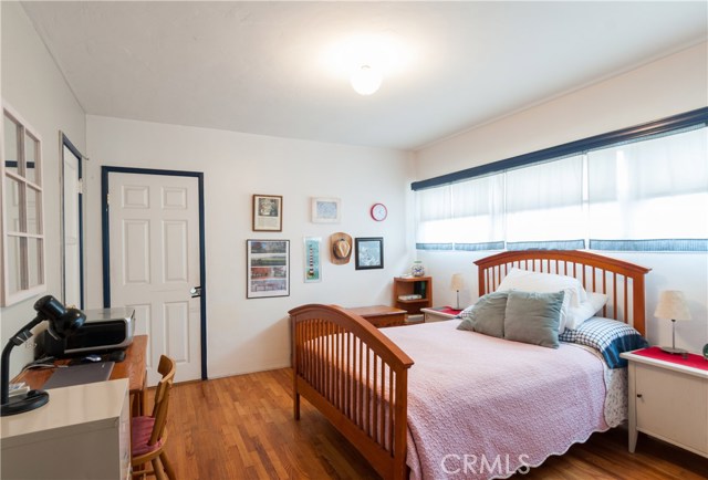 Same deal with apartment #2's bedroom...sunny west facing wall of windows and large closet. Door between units is closed.
