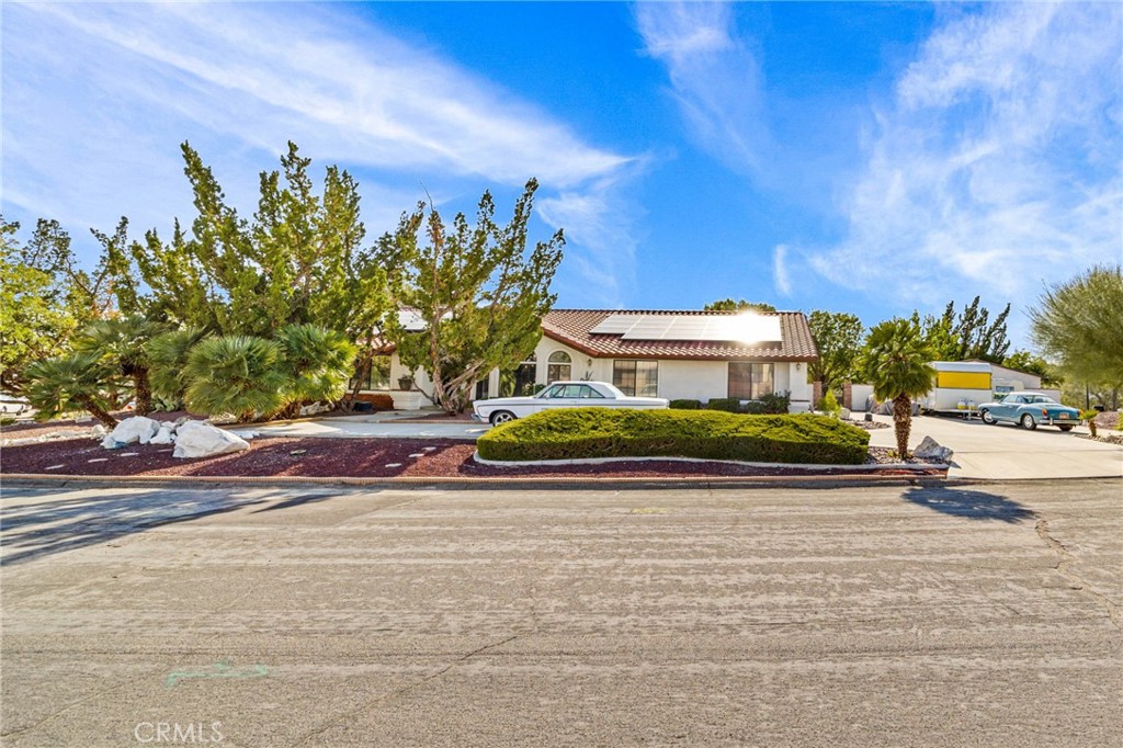 16510 Olalee Road Apple Valley, California This gorgeous single story 4 bedroom 3 bathroom pool home located in the highly sought out city of Apple Valley is waiting for the perfect family. This home features plenty of space for living and entertaining. This home has many upgrades and is very well maintained. New exterior paint, stucco retaining wall and all wrought iron accents and wrought iron gates. New laminate wood/ceramic flooring throughout. Central vacuum. Updated kitchen with plenty of counter space, new cabinets with granite counter tops and granite double sink. The kitchen also features a new garbage disposal and dish washer. The gas fireplace is adorned with new granite. Huge walk in pantry. Laundry room has matching granite counter tops. Sky light in kitchen and bathroom. Sliding patio doors replaced with French Doors. New recessed lighting and light fixtures interior and exterior. Huge master suite, and generously oversized bedrooms. This home has crown molding, wood burning/gas fireplace and new mirrored walk in closet doors. Newly remodeled bathrooms add class to this unique home. The large covered patio is perfect for added space to entertain or just lounge around. There is new pool equipment for the in ground swimming pool and spa. Extra large shed with exterior stucco and interior finished drywall. Gorgeous view of evening city lights from backyard. The arched door ways add character to an already perfect home. Do not miss out on this must see one of a kind home.