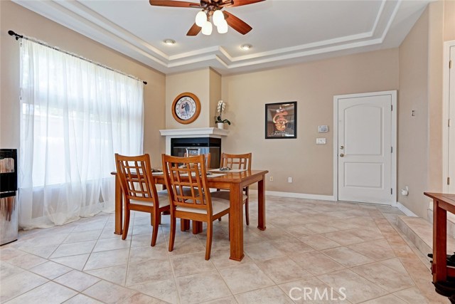 Dining area is spacious enough to utilize floorplan in different ways--like making a cozy family room here and moving dining table to area by sliding glass door in spacious living room