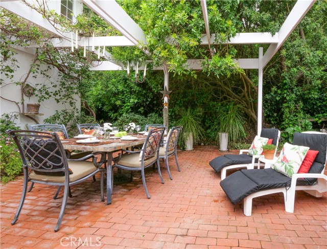 Wonderful setting for entertaining on your arbor covered brick patio
