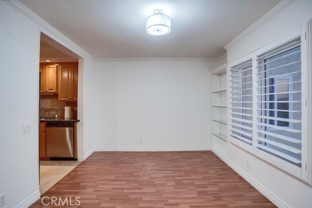 Dining room has built in display shelves.