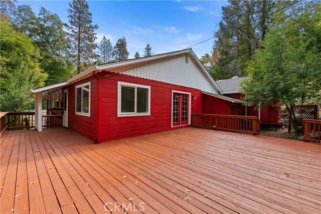 Back of apartment with large deck over looking Kelsey Creek