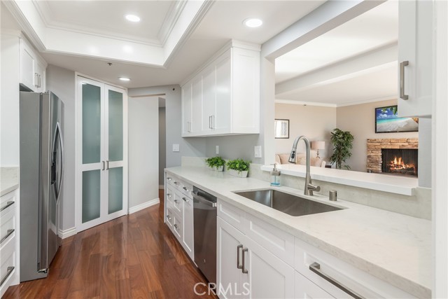 Kitchen opens up to both the living room and dining.  Tall doors in the rear opens to the stackable laundry