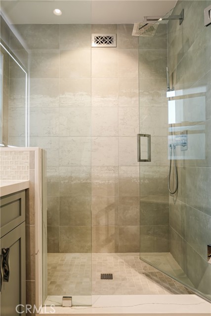 Primary bathroom - large walk in shower with frameless glass enclosure