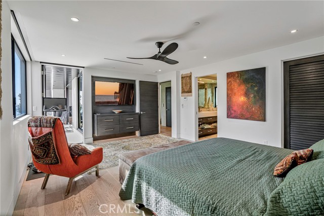 Primary suite showing the door to the ocean view deck