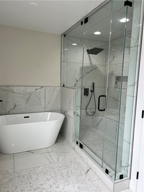 Master bath features separate tub and shower