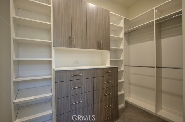 Custom Walk-in Closet with plenty of storage and build in drawers.
