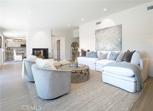 living room with see thru wood and gas burning fireplace