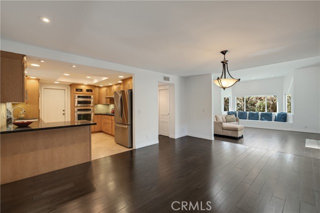 Open floor plan from kitchen to dining/den and living room.