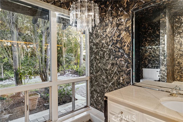 The main bathroom features gorgeous views of the garden.