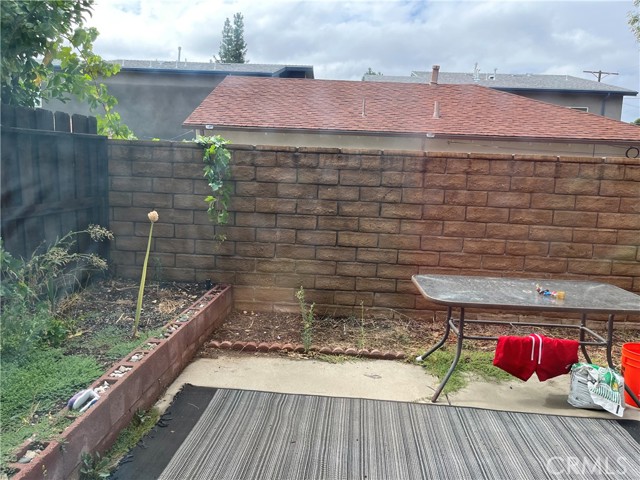 Sunny, low maintenance backyard with room for vegetable garden!