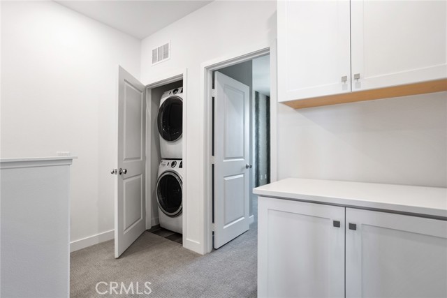 Laundry area with Washer Dryer and folding storage area 3rd Floor