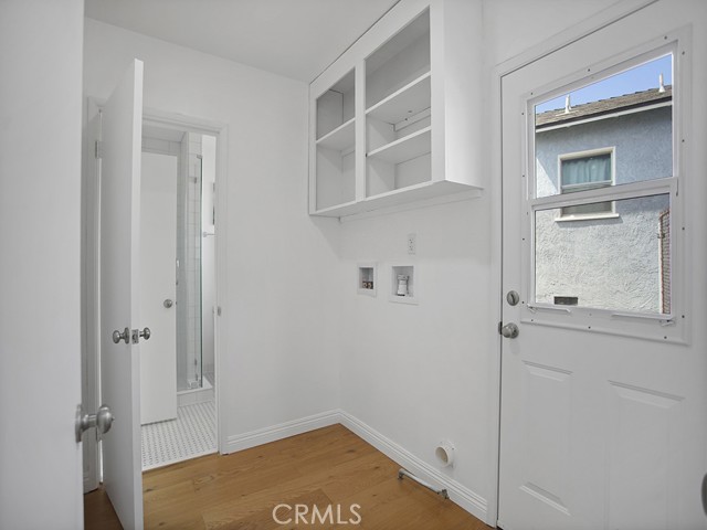 Washer and Dryer Hook ups in Separate Room with Extra Shelving