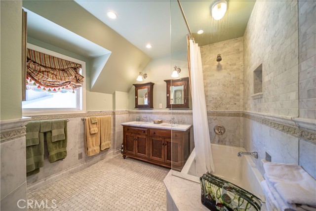 Spacious full bath with beautiful tile detailing