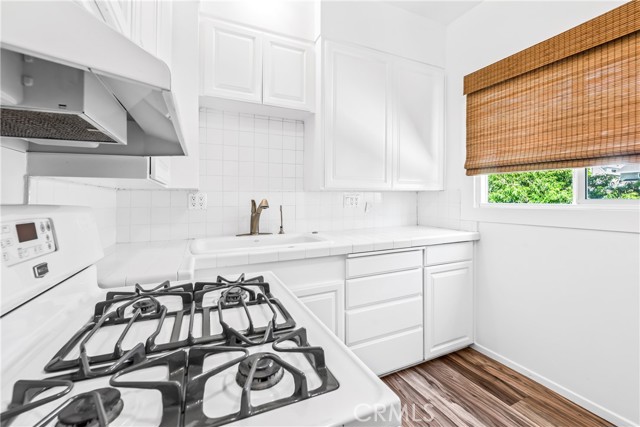 The kitchen has a door to the adorable backyard.