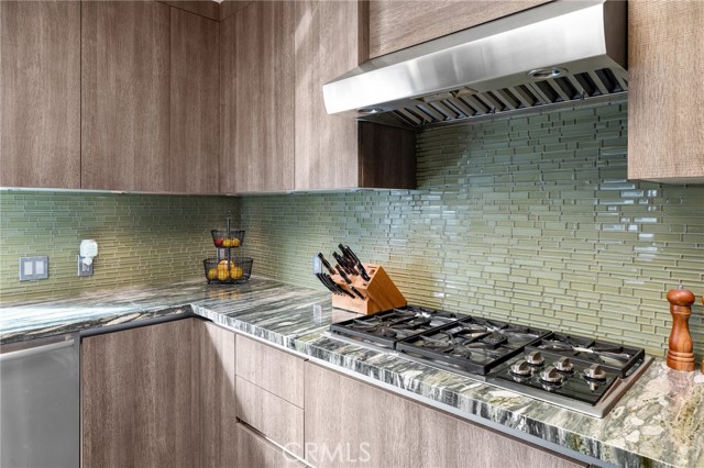The backsplash custom tiles blend in beautifully. And many a tasty meal will be loovingly created on that custom stove.