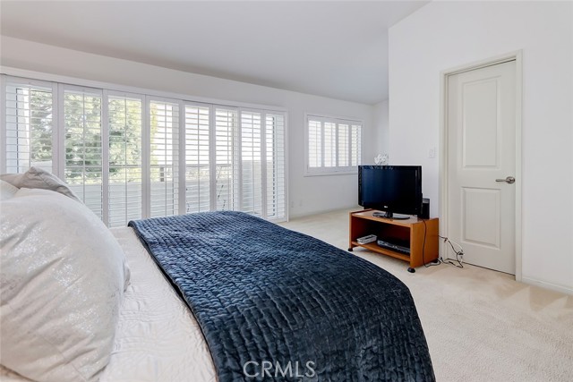 Primary bedroom has forever views!